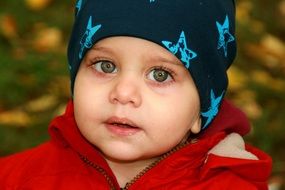 beauty of the child on the background of autumn nature in park