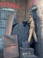 happy young man at industrial tank