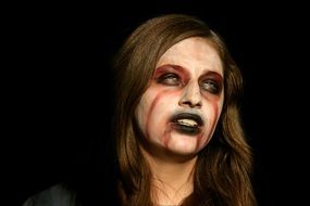 girl's face painted for Halloween causes fear and horror