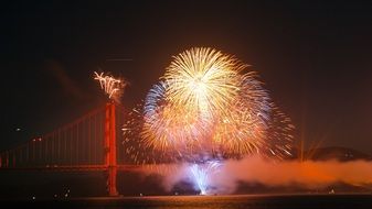bright fireworks firing of golden gate bridge at san fracisco