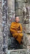 cambodia monk near the stone temple