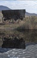 wooden wagon reflected in river