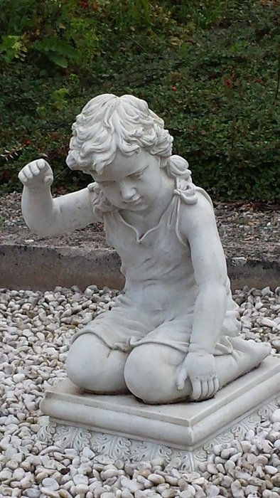 sculpture of a child in the cemetery