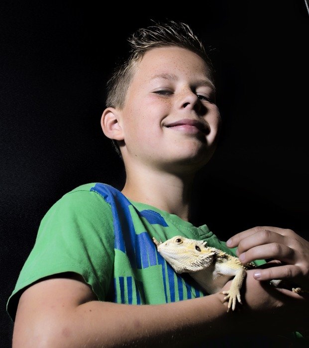 happy boy with lizard