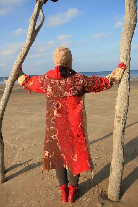 woman in red dress on the beach