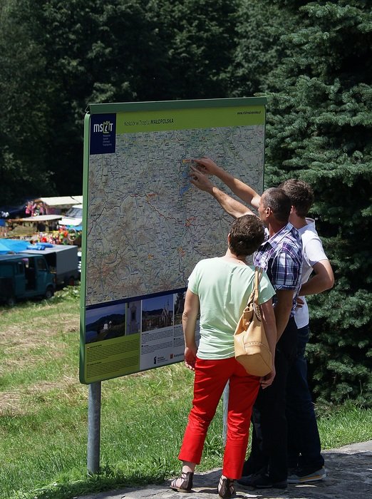 tourists at the information stand MaÅopolska in Poland