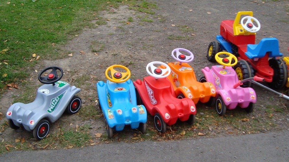 many colorful bobby cars in the playground