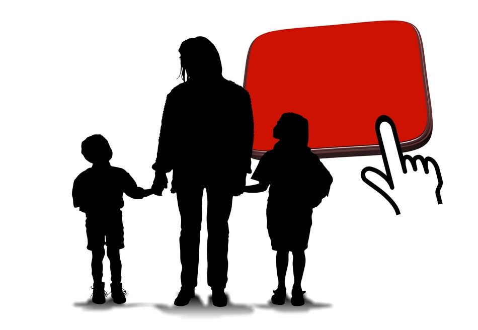 man with children and red button drawing