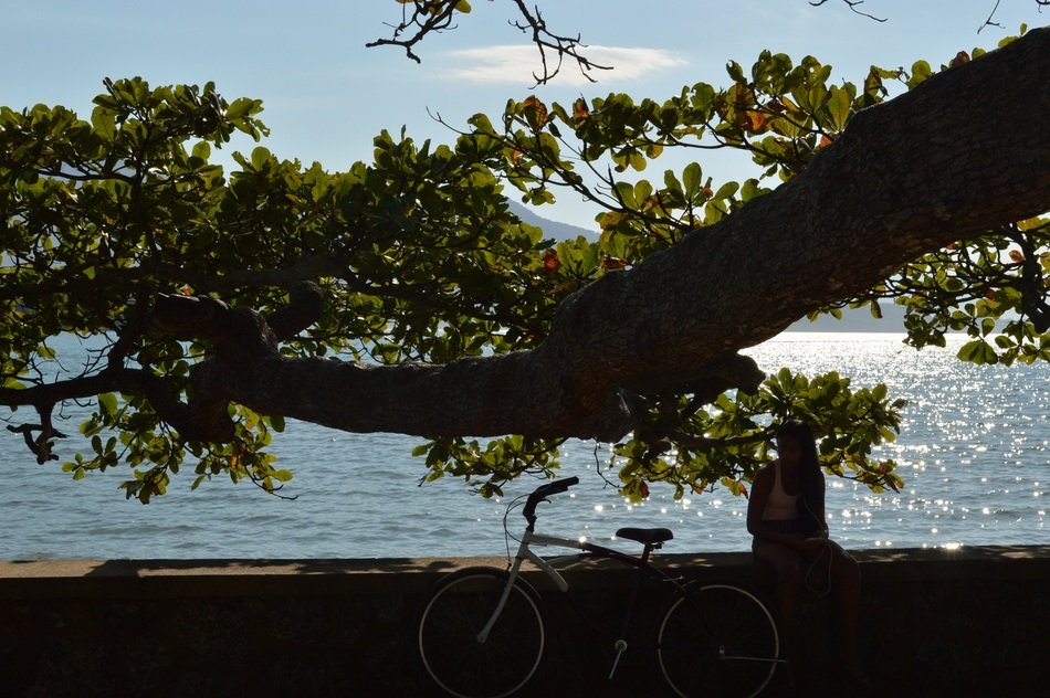 girl near the bike under the tree