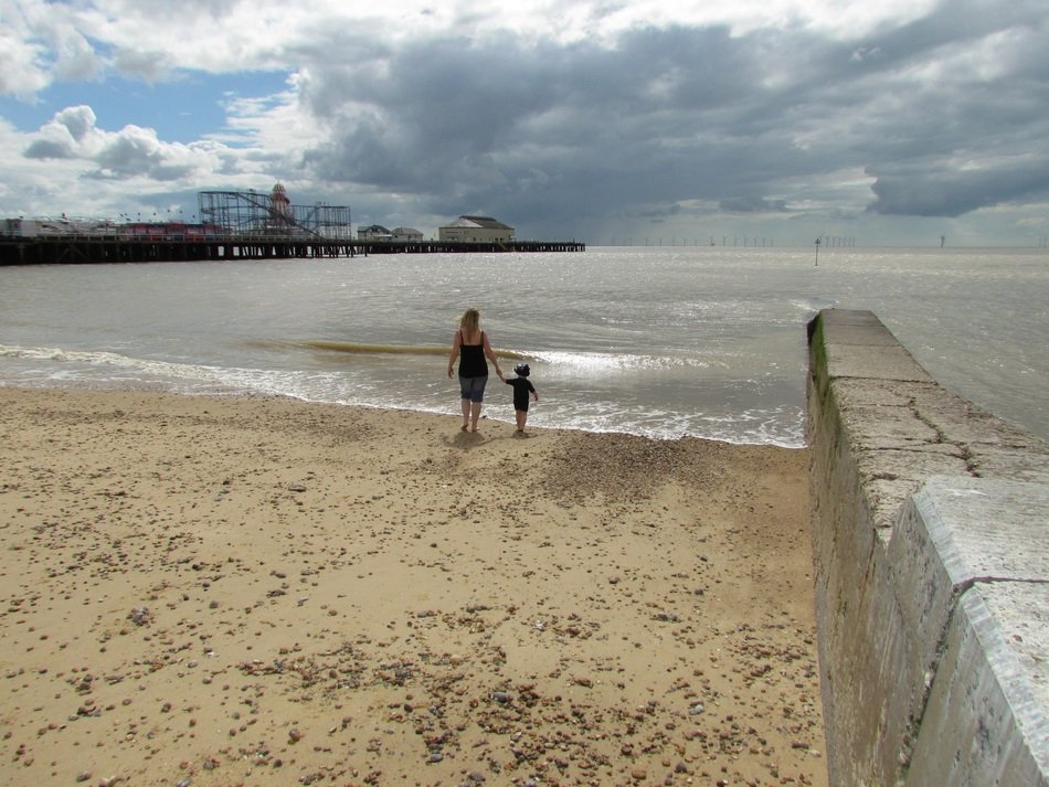 mom with baby on the beach