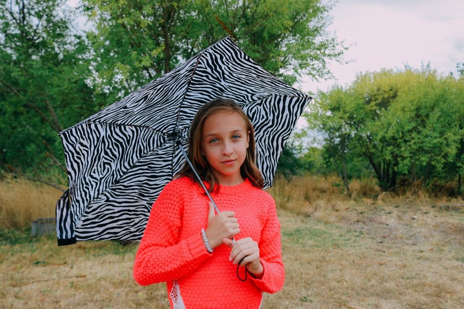 young girl blue eyes with umbrella