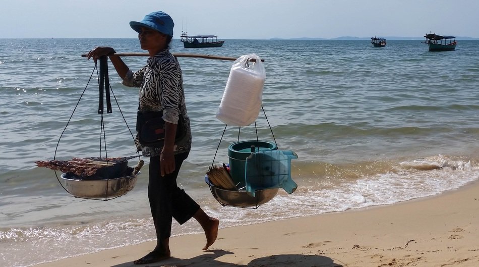 Woman seller on the beach in cambodia