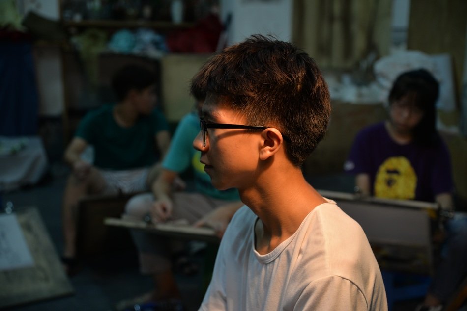 studio entrance examination art boy in glasses