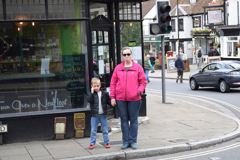 Mother and son try to cross a road
