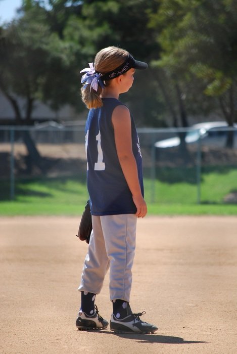 girl on the field in softball