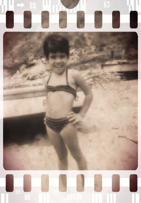 child on beach old photo