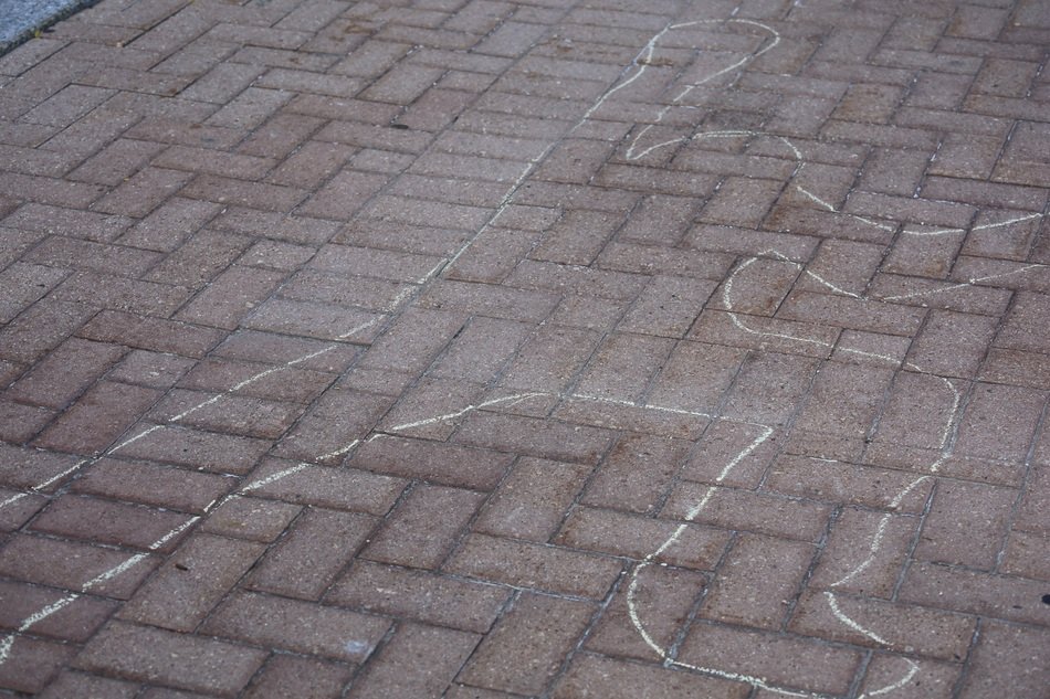 chalk outline on the ground after crime scene