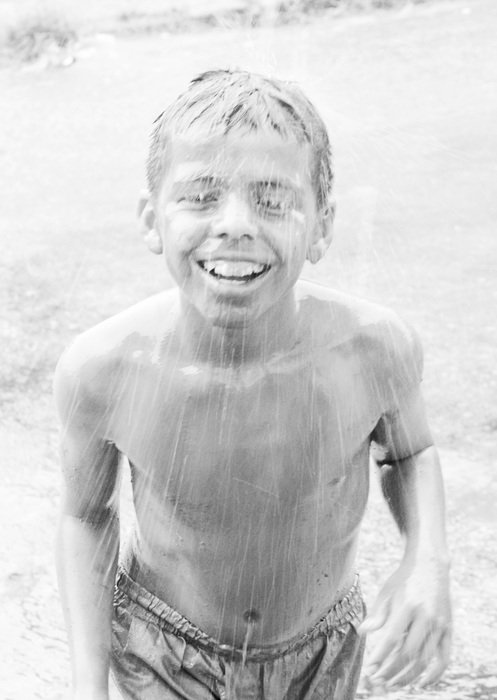 child playing at rainy weather