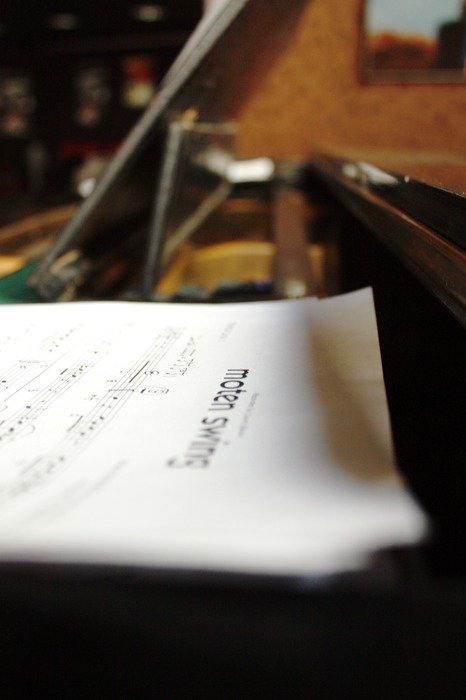 Scores lie on the piano