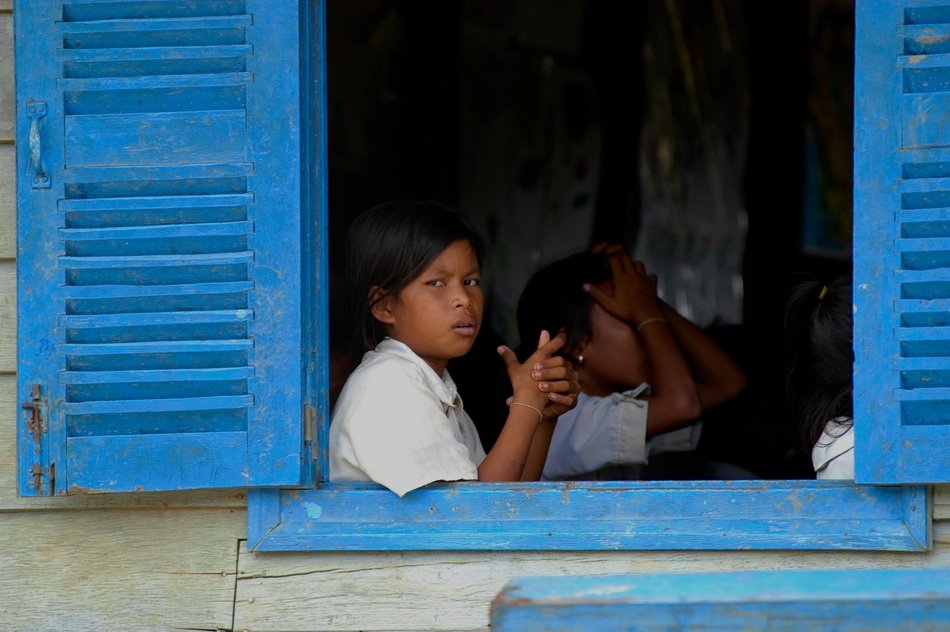 poor children near the window