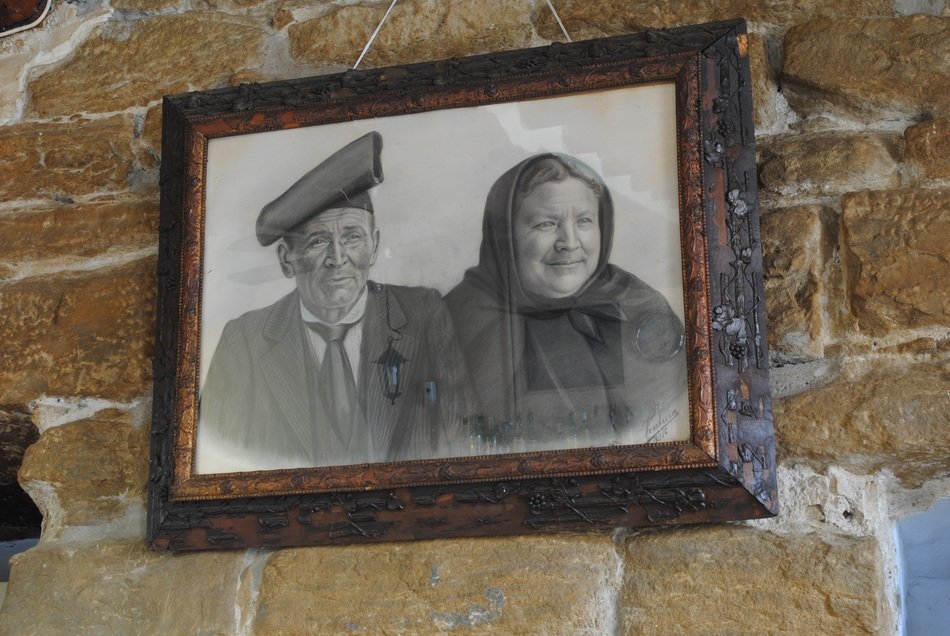 old photo of elderly on the wall