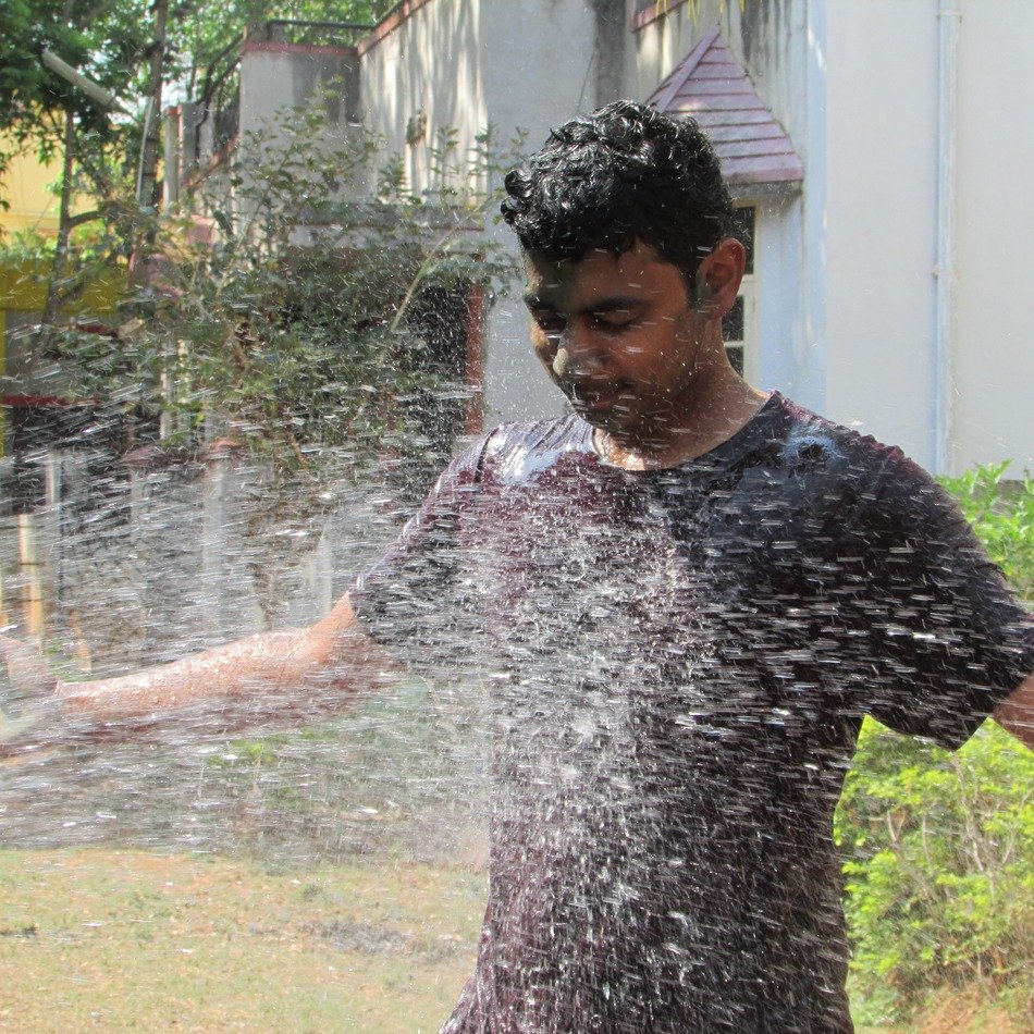 man near the fountain in india