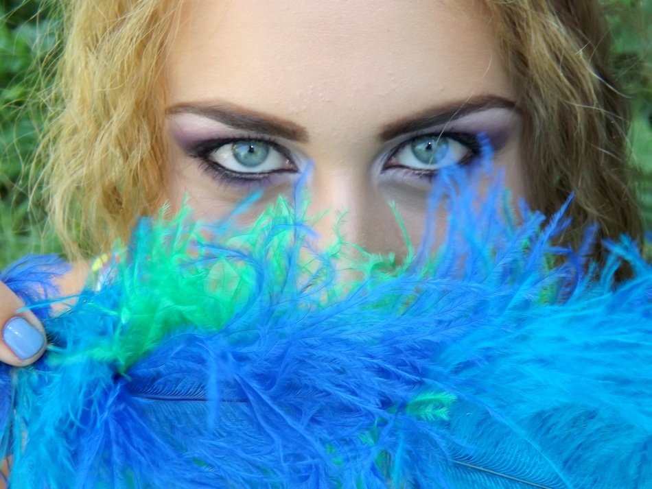 Girl with the blue and green feathers