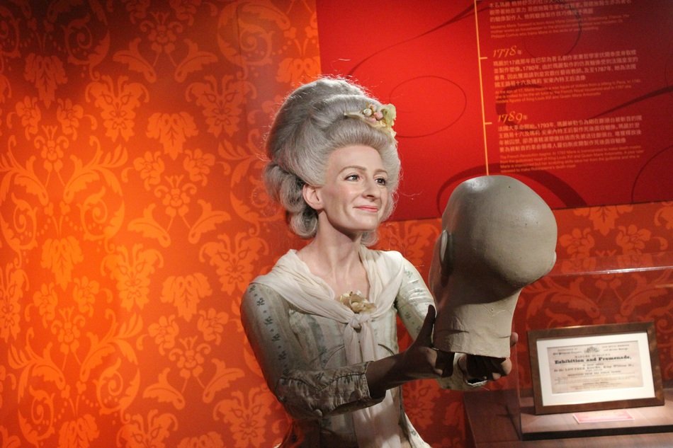 female wax figure holding human head, china, Madame Tussauds Hong Kong museum