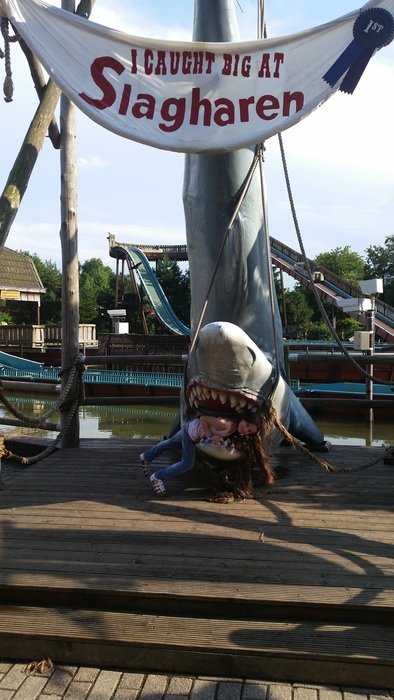 girl in the mouth of a toy shark slagharen