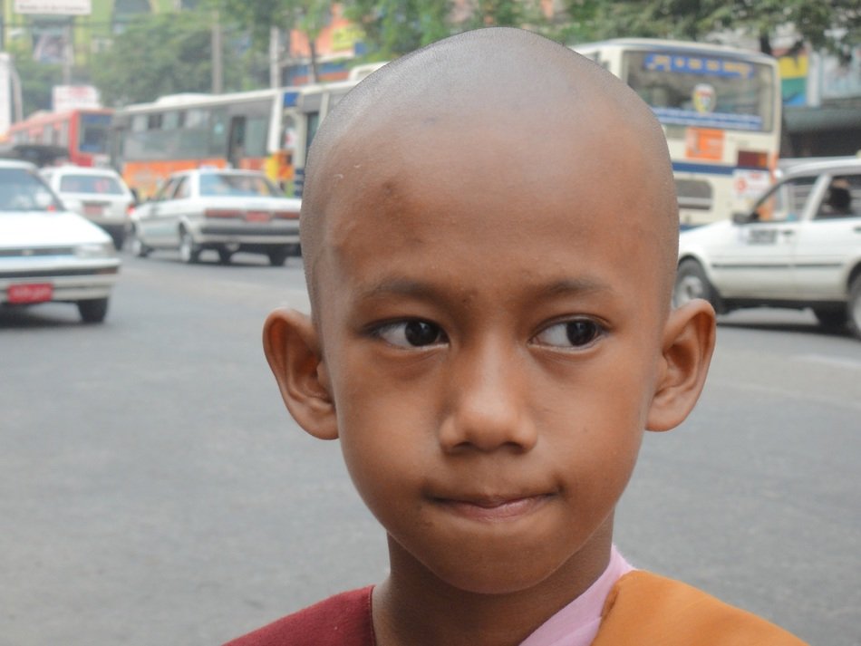face of child believer in religion Buddhism