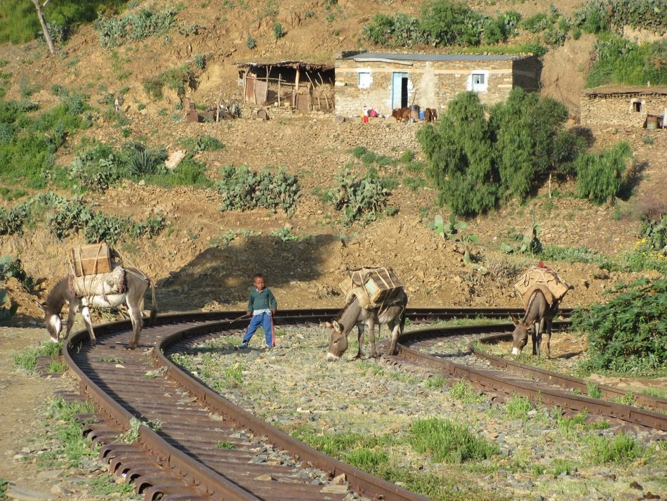 man among railway tracks in italy