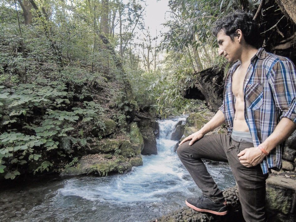 man near the forest river