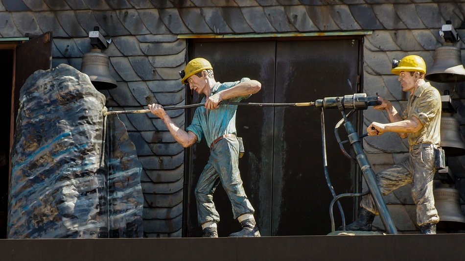 workers with a jackhammer in mining