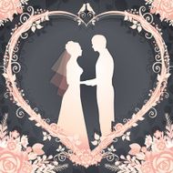 Bride and Groom framed in a floral wreath heart