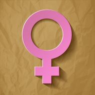 Venus symbol pink on a crumpled paper brown background