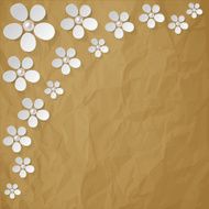White flowers pearls in the corner on a brown background