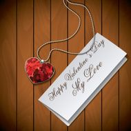 Letter with pendant on wood background N2