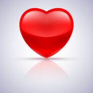 Glossy red heart on grey