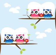 Couples of owls sitting on branches