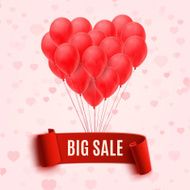 Balloons in form of heart holding big sale red banner