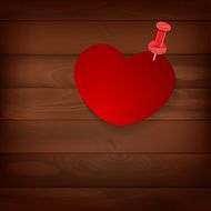 pinned heart on wood