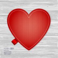 Valentines kniited heart on a wood background