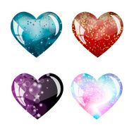 Four beautiful glass hearts with different backgrounds