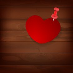 pinned heart on wood