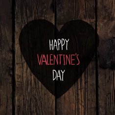 Heart symbol on wooden texture