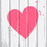 Pink heart on white wall