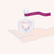 Hand giving the gift of a heart under glass dome