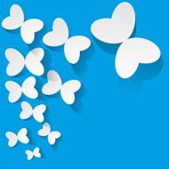 White paper butterflies on a blue background