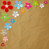 Colorful flowers pearls in the corner on a brown background