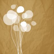 Flowers dandelions on a crumpled paper brown background